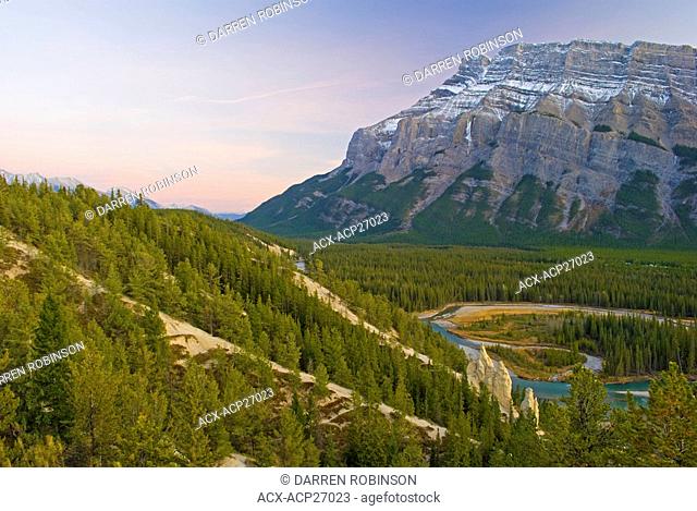 Mount Rundle towers over Rocky Mountain hoodoos near Banff, Alberta, Canada