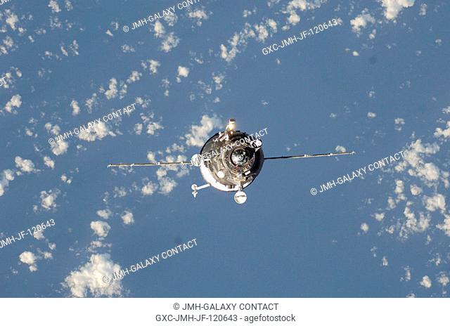 Backdropped by a blue and white Earth, an unpiloted Progress supply vehicle approaches the International Space Station. The Progress 26 resupply craft launched...