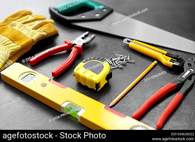 different work tools on slate background