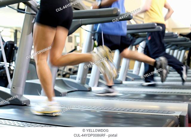 Blurred view of people on treadmills