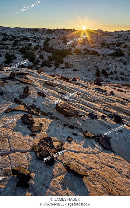 Sunrise above Navajo sandstone and lava chunks, Grand Staircase-Escalante National Monument, Utah, United States of America, North America