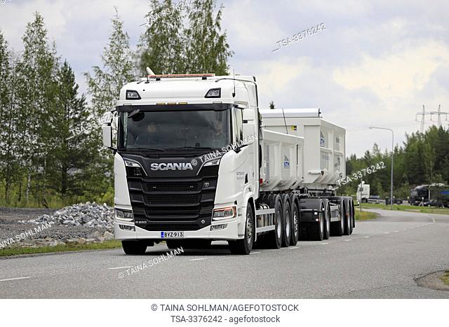 Turku, Finland. August 23, 2019. White Next Generation Scania R650 truck pulls gravel trailer on road test. Scania in Finland 70 years tour
