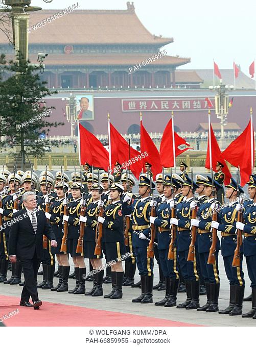 German President Joachim Gauck reviews honour guards during a welcome ceremony at the Great Hall of the People in Beijing, China, 21 March 2016