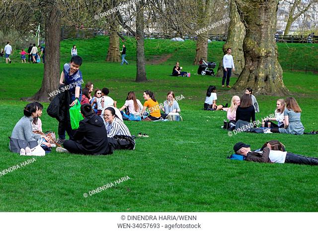 Tourists and Londoners enjoy warm spring sunshine in St James Park in Westminster as higher temperatures are forecast across the UK in coming week