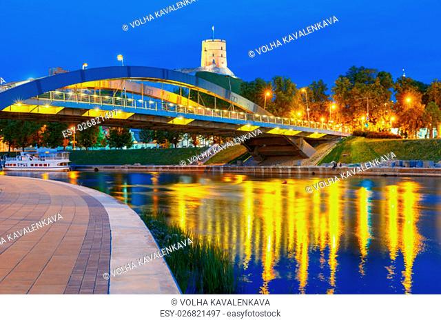 Night Gediminas Tower and King Mindaugas Bridge across Neris River in the city Vilnius, Lithuania, Baltic states