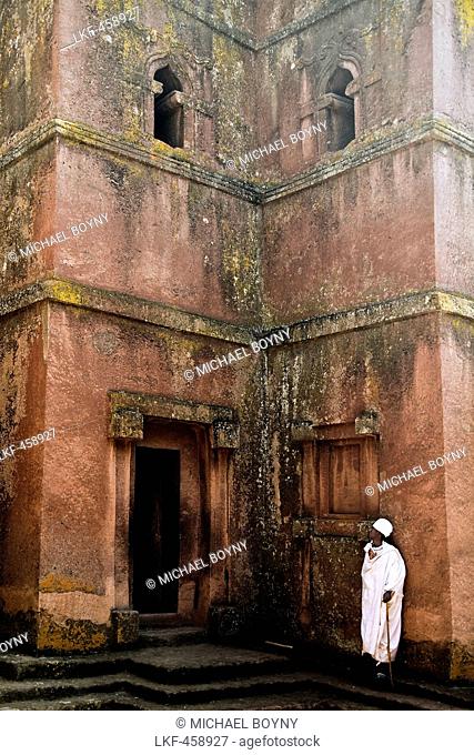 Religious man in front of the church of St. George, Lalibela, Ethiopia, Africa
