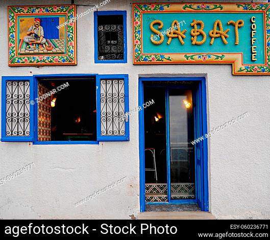 Entrance traditional Tunisian coffee bar, colourful tiles, blue door. High quality photo
