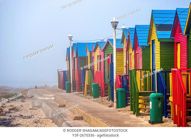Mist morning at a beach with colourful bathing cubicles. St James Beach, tidal pool, Cape Town, South Africa