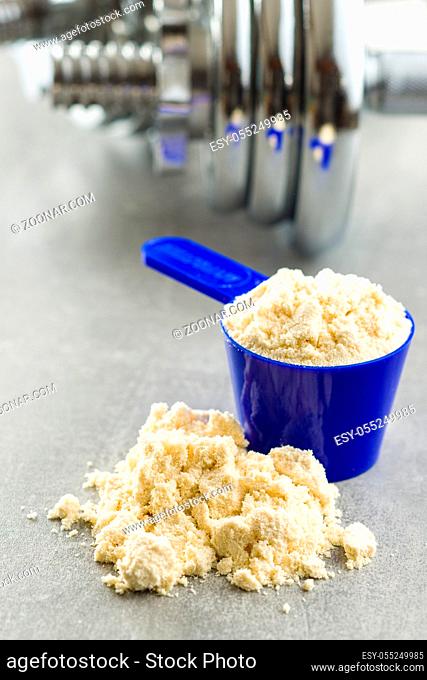 Whey protein powder in scoop
