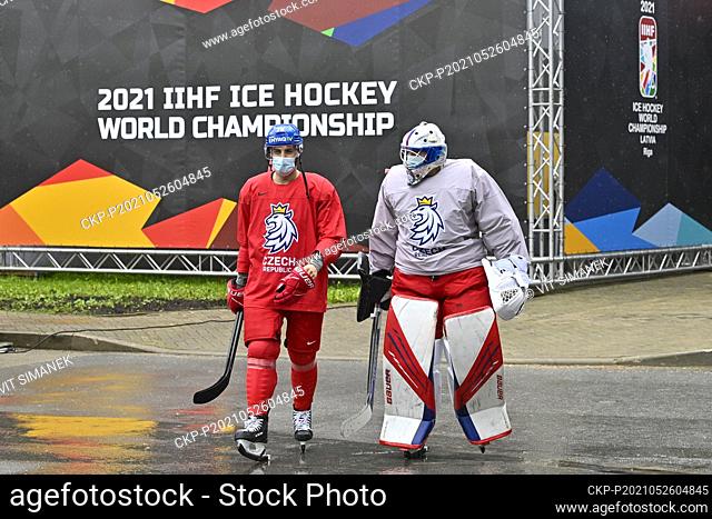 Robin Hanzl, left, and Roman Will of Czech Republic on the way to a bus that will take them to the training hall during the 2021 IIHF Ice Hockey World...