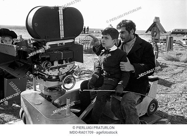 Egyptian actor Omar Sharif showing something to his son Tarek Sharif in front of a camera on the set of of the film Doctor Zhivago. 1965