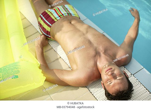 Swimmingpool, man, trunks,  Basin edge, lie, suns   20-30 years, relaxation, recuperation, relaxen, resting, enjoying, lazes about, sunbath, vacation, summer