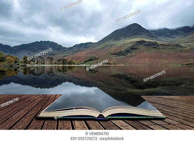 Beautiful Autumn Fall landscape image of Lake Buttermere in Lake District England concept coming out of pages in open book