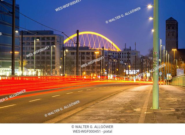 Germany, North Rhine-Westphalia, Cologne, Cologne-Deutz, Deutz Bridge and Lanxess Arena in the background, in the evening