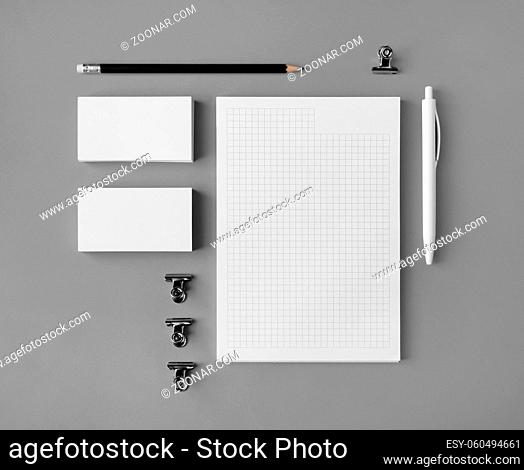 Blank corporate stationery set on gray paper background. Branding mock up. Flat lay