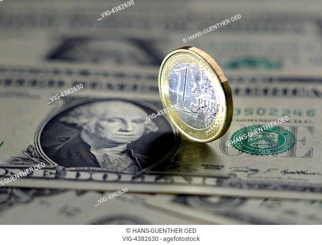 29.04.2014, Unkel, DEU, Germany, one EURO coin on one Dollar bank notes - Unkel, Rhineland-Pala, Germany, 29/04/2014
