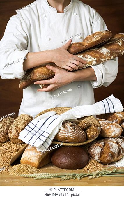 A baker holding bread Sweden