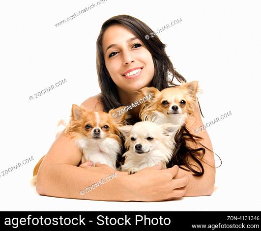 portrait of a woman andthree chihuahuas in front of white background
