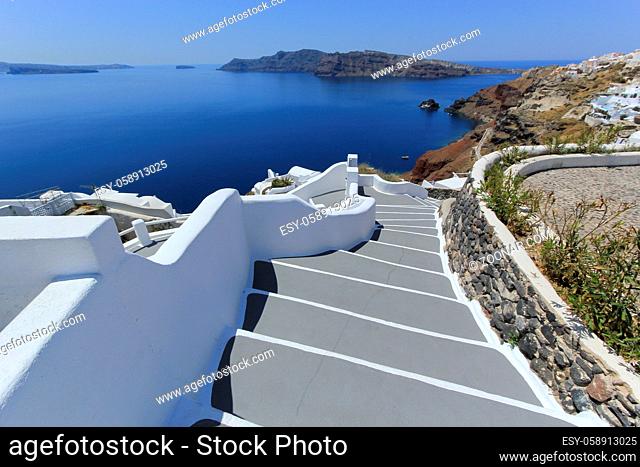 Stairs and volcano at Oia island by beautiful day, Greece