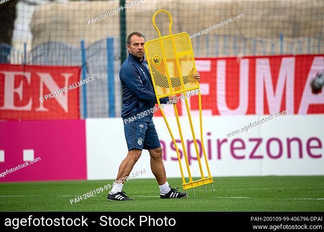 09 January 2020, Qatar, Doha: Coach Hansi Flick is standing on the training ground during a practice session of FC Bayern Munich in the morning