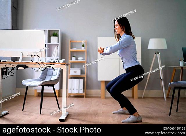 Workplace Sit Up Exercise At Office Desk
