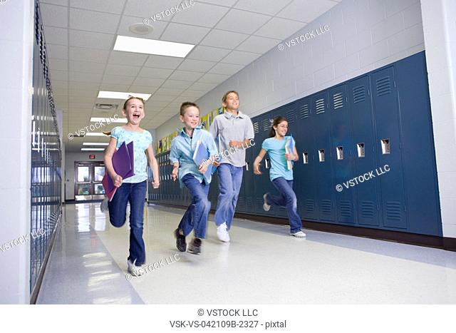 USA, Illinois, Metamora, Children 8-9, 10-11 running through school corridor
