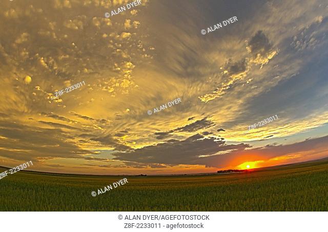 Cloudscape at sunset, July 28, 2010, taken from home with Canon 7D and 15mm lens, grabbed in a hurry and hand-held for a set of 4 exposures for a high-dynamic...