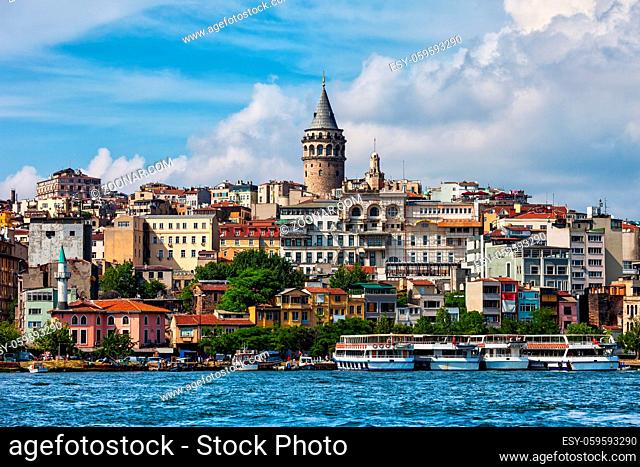 Istanbul city skyline in Turkey, view from Golden Horn, houses in Beyoglu district with Galata tower in the midlle