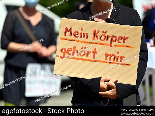 02 June 2021, Thuringia, Erfurt: ""My body belongs to me"" is written on the poster of a participant of the meeting of the pro familia state association in...