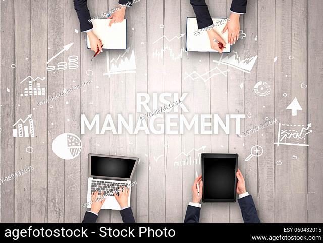 Group of Busy People Working in an Office with RISK MANAGEMENT inscription, succesfull business concept
