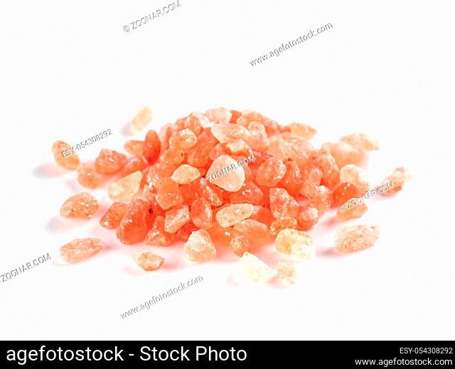 Himalayan pink salt in crystals on white background. Heap of pink salt isolated with clipping path