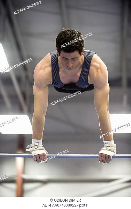 Male gymnast on horizontal bar