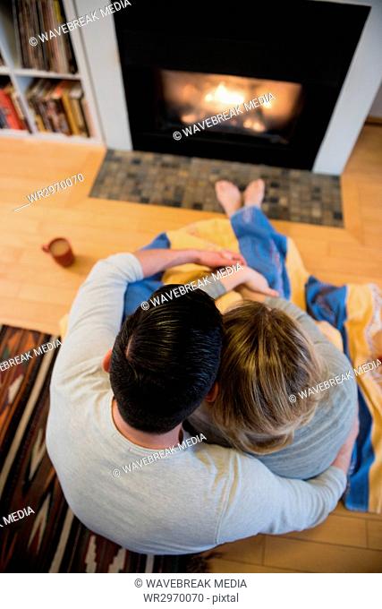 Affectionate couple relaxing in living room