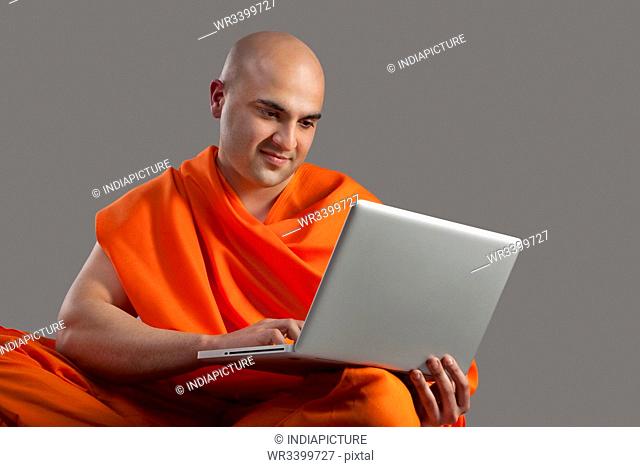 Monk with a laptop