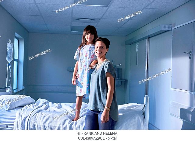 Portrait of girl patient and mother in hospital children's ward