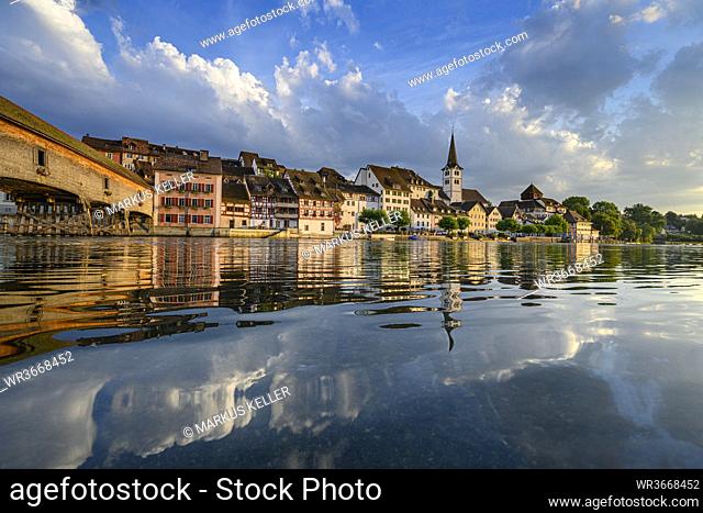 Switzerland, Canton of Thurgau, Diessenhofen, Shiny surface of High Rhine with village houses in background