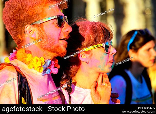 Portrait of young couple taking part in The Color Run in Trieste, Italy. Trieste is the capital of the autonomous region Friuli-Venezia Giulia