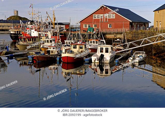 Boats and their reflections in the harbor of Stø, Sto, on the island of Langøya, Langoya, part of the Vesterålen, Vesteralen archipelago, Nordland, Norway
