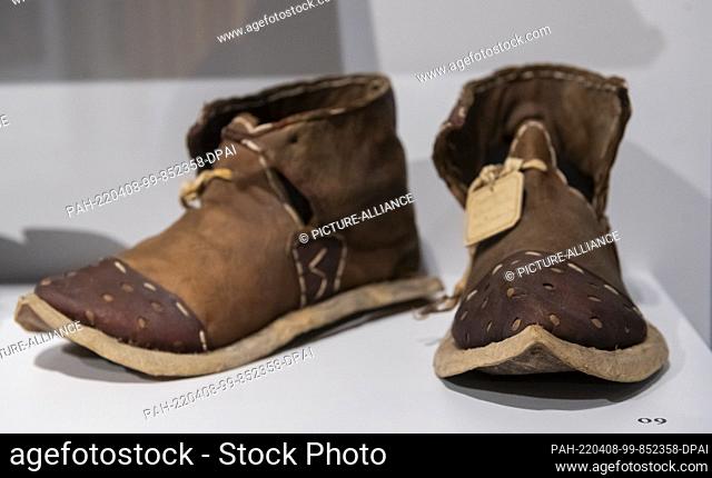 25 March 2022, Saxony, Herrnhut: The leather shoes from Jerusalem, late 19th century, are an exhibit of the special exhibition ""Aufbruch. Network