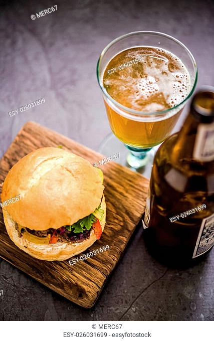 serving beef burger with local artisan Ale beer, gastro pub