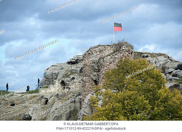 Hikers climbing to the Regenstein castle ruins - with its rooms hewn into the rock - under the sunny autumn weather in Blankenburg, Germany, 12 October 2017