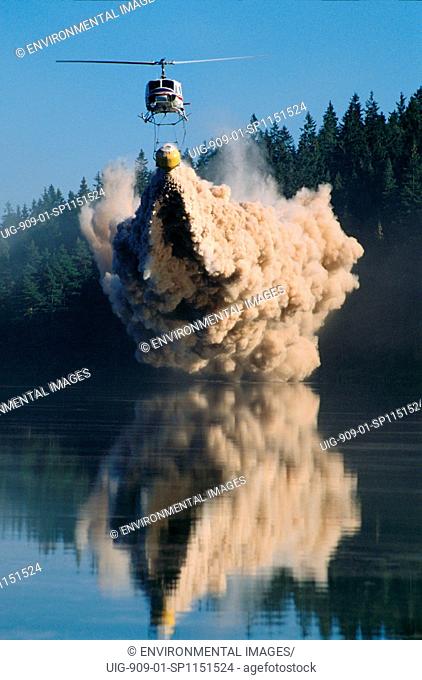 ACID RAIN - SWEDEN. Vicinity Goteborg, Lake Ovre Bergsjon. A helicopter dumps lime into a dying lake to neutralize the acid which is killing it