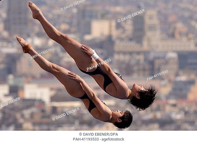 Huixia Liu and Ruolin Chen of China in action during the women's 10m Synchro Platform diving preliminaries of the 15th FINA Swimming World Championships at...