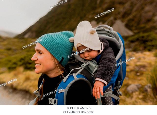 Hiker and baby exploring trail, Wanaka, Taranaki, New Zealand