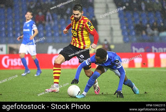 Mechelen's Sandy Walsh and Genk's Mike Tresor Ndayishimiye fight for the ball during a soccer match between KRC Racing Genk and KV Mechelen