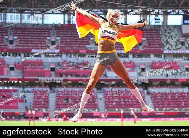 dpatop - 03 August 2021, Japan, Tokio: Athletics: Olympics, long jump, women, final at the Olympic Stadium. Malaika Mihambo from Germany jumps and cheers for...