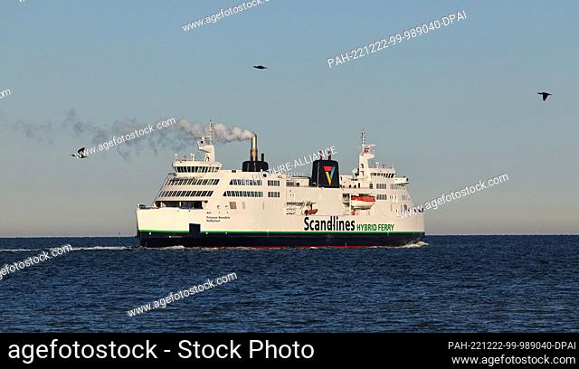 PRODUCTION - 16 December 2022, Schleswig-Holstein, Fehmarn: The Scandlines hybrid ferry ""Prinsesse Benedikte"" leaves the ferry port of Puttgarden and sails on...