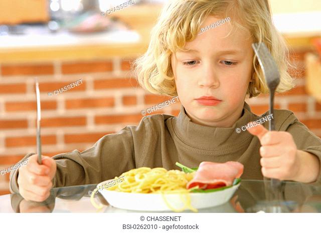 CHILD EATING A MEAL