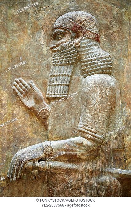 Stone relief sculptured panel of a dignitary . Facade L. Inv AO 19875 from Dur Sharrukin the palace of Assyrian king Sargon II at Khorsabad, 713-706 BC