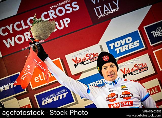 Belgian Michael Vanthourenhout celebrates on the podium after winning the men's elite race of the Cyclocross World Cup race in Val di Sole, Italy
